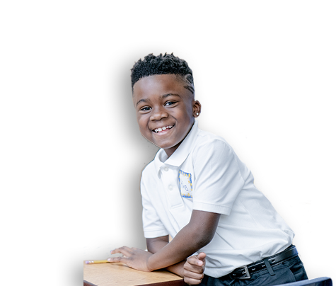 SCS African American Student smiling by desk